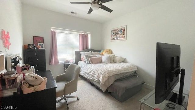 bedroom with ceiling fan and carpet