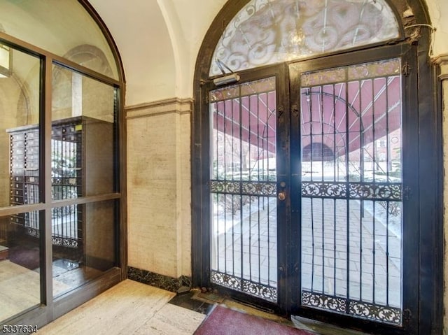 interior space with french doors and hardwood / wood-style flooring