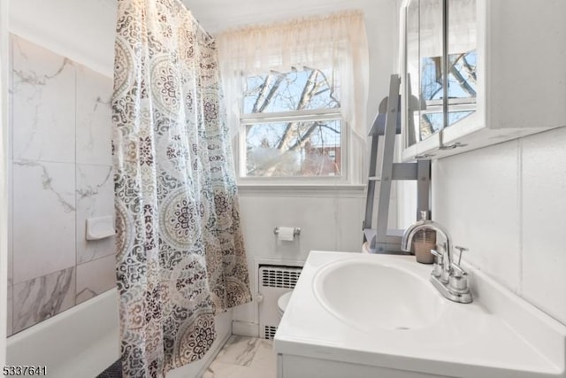 bathroom with shower / tub combo with curtain, vanity, and radiator heating unit