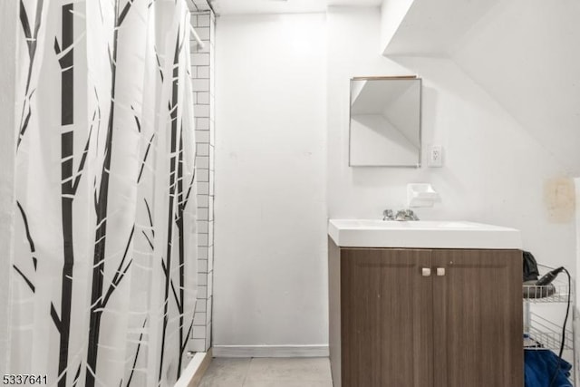 bathroom featuring tile patterned flooring, vanity, and a shower with shower curtain