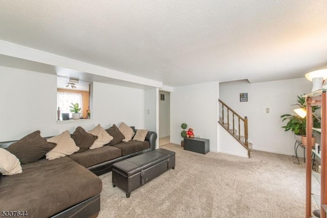 carpeted living room with a textured ceiling