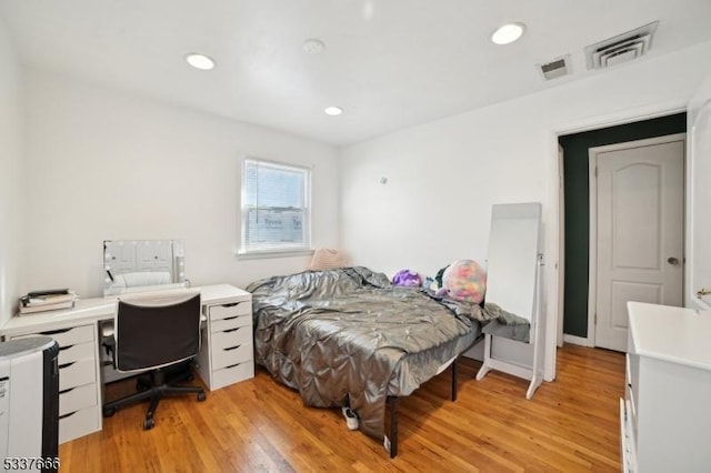 bedroom with light hardwood / wood-style flooring