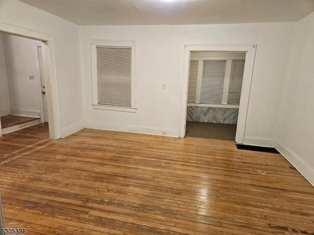 empty room featuring wood-type flooring