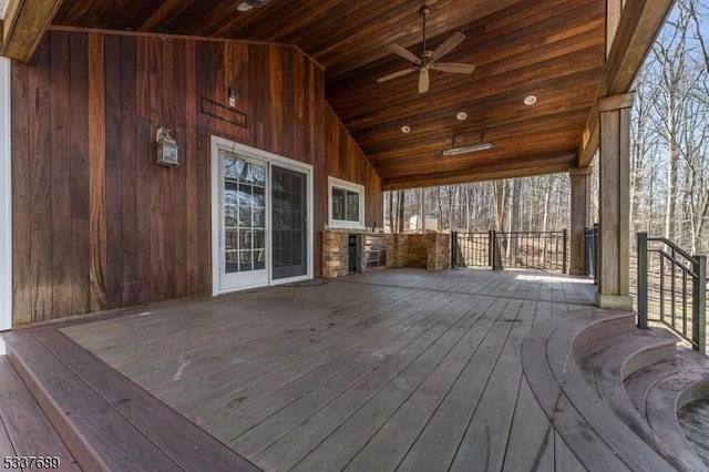 wooden deck featuring a ceiling fan