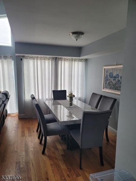 dining room with dark hardwood / wood-style floors