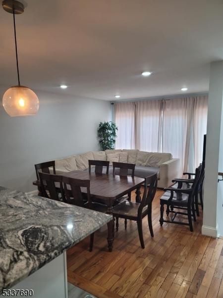 dining area featuring a wealth of natural light and hardwood / wood-style floors