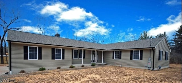 ranch-style house featuring a chimney