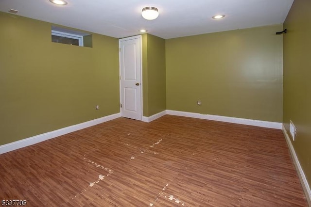 basement featuring wood-type flooring