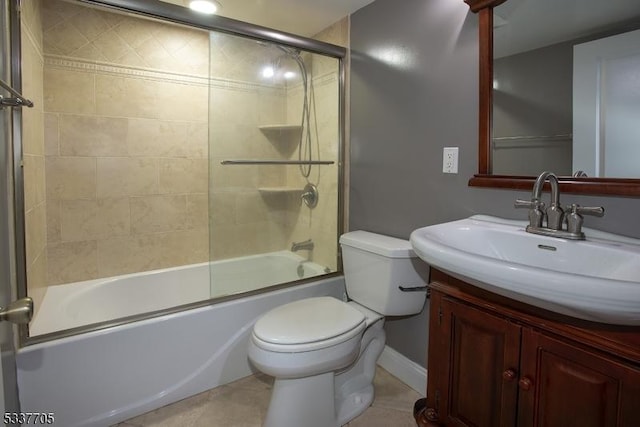 full bathroom featuring vanity, tile patterned flooring, enclosed tub / shower combo, and toilet