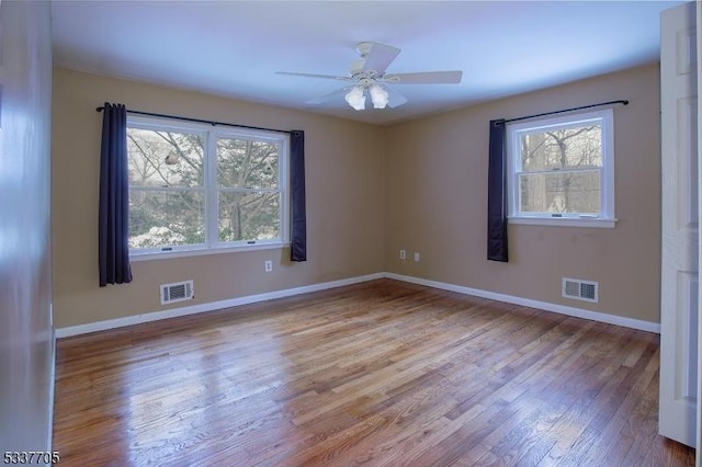 empty room featuring ceiling fan and light wood-type flooring