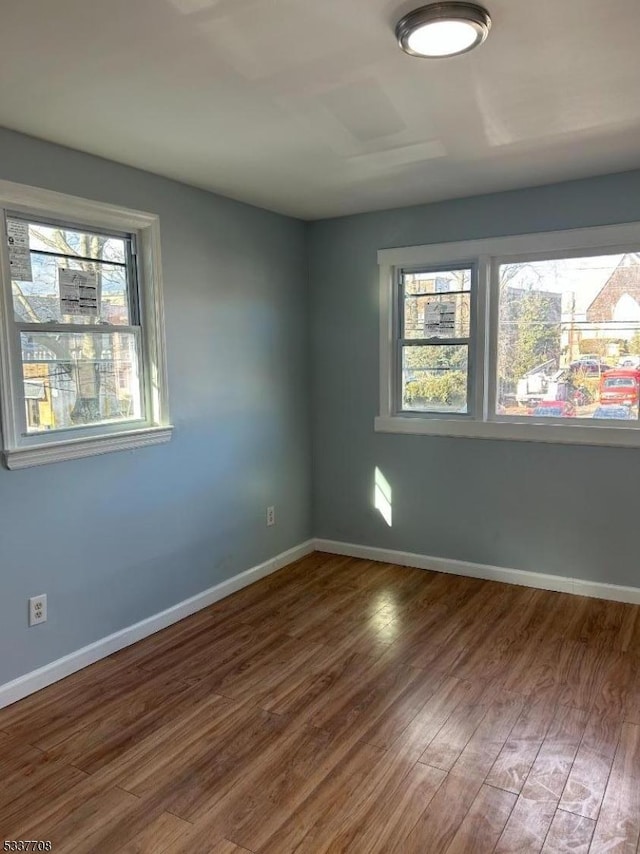 empty room featuring hardwood / wood-style flooring