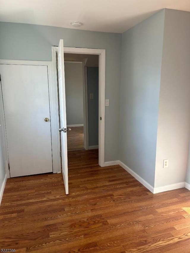 spare room featuring dark hardwood / wood-style floors