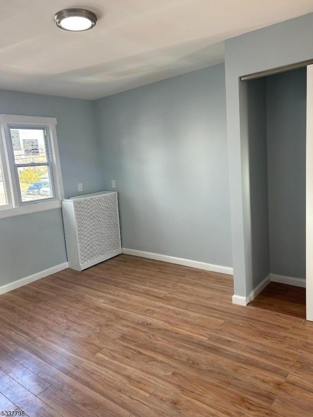 spare room with light hardwood / wood-style floors