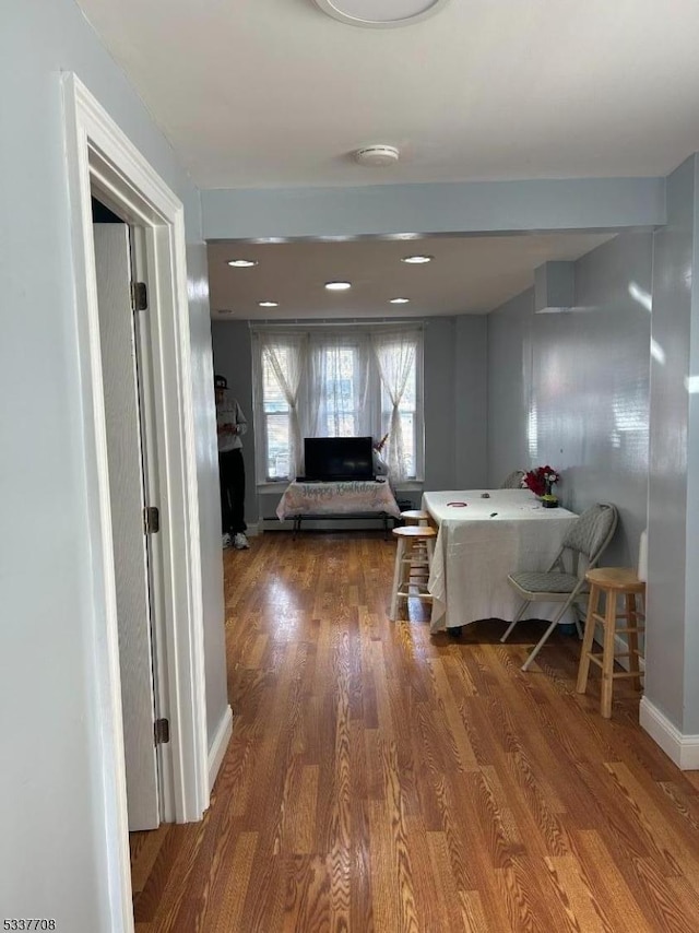 corridor featuring hardwood / wood-style floors