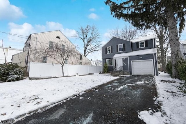 view of front of property with a garage