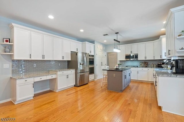 kitchen with stainless steel appliances, light wood-type flooring, open shelves, and white cabinets