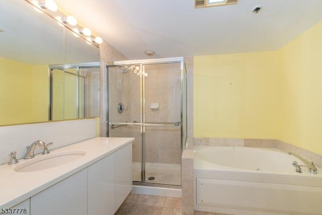 bathroom featuring vanity and separate shower and tub