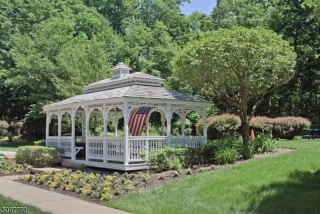 surrounding community with a gazebo and a lawn