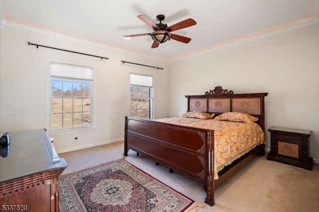 bedroom featuring crown molding, light colored carpet, and ceiling fan