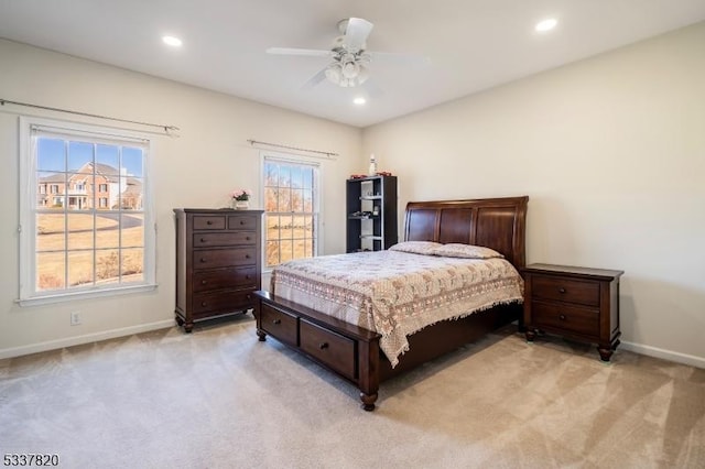 bedroom with light colored carpet and ceiling fan