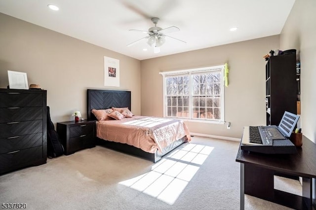 bedroom with light carpet and ceiling fan