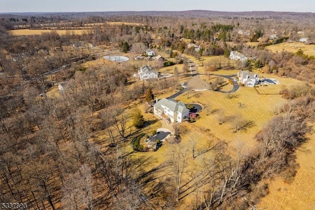 birds eye view of property with a rural view