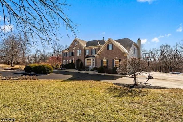 front facade with a front yard