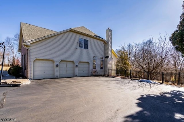 view of property exterior with a garage