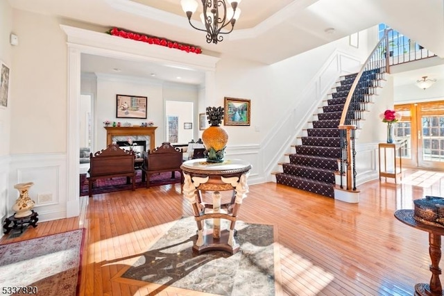 foyer featuring an inviting chandelier and hardwood / wood-style floors