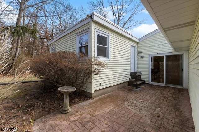 view of property exterior featuring a patio