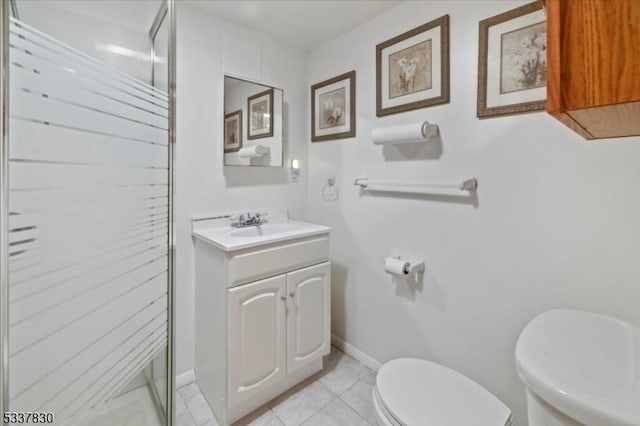 full bath with tile patterned flooring, a shower stall, baseboards, toilet, and vanity