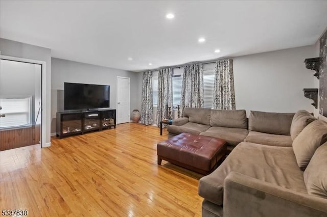 living room featuring recessed lighting and light wood-style floors