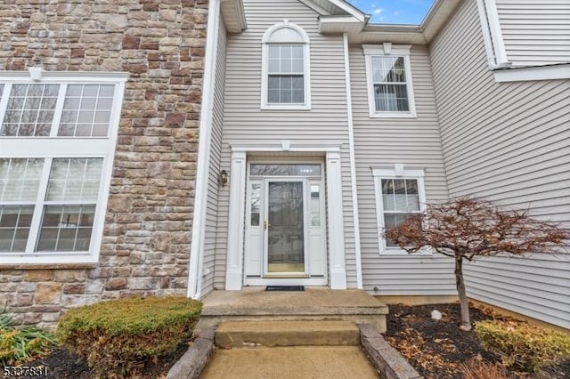 view of exterior entry with stone siding