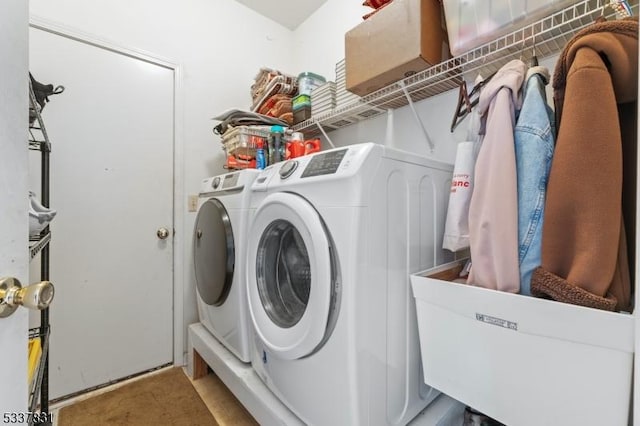 laundry area with laundry area and washer and clothes dryer