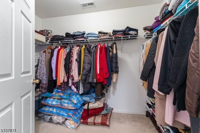 spacious closet with carpet floors and visible vents