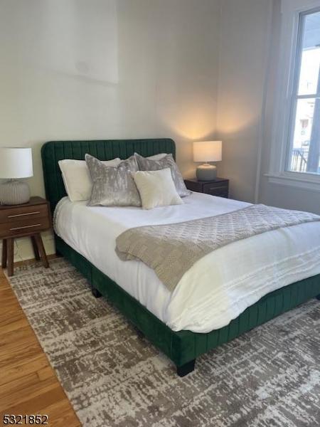 bedroom featuring wood-type flooring