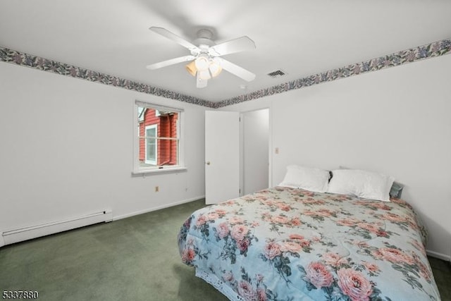 carpeted bedroom featuring baseboards, visible vents, baseboard heating, and a ceiling fan