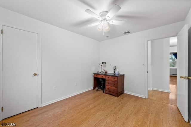 bedroom featuring a ceiling fan, light wood-type flooring, visible vents, and baseboards