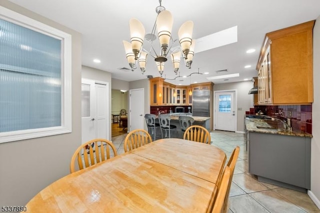 dining room with a chandelier, recessed lighting, visible vents, and light tile patterned floors