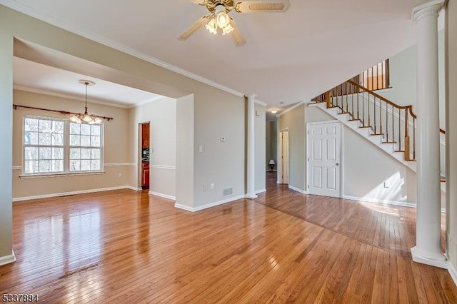 unfurnished living room with light wood-type flooring, ornate columns, and ornamental molding