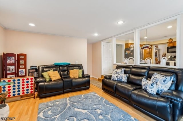 living room with wood finished floors and recessed lighting