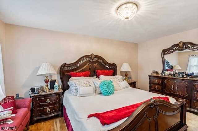 bedroom with light wood-type flooring