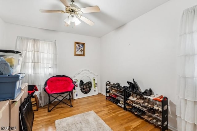 interior space with ceiling fan and wood finished floors