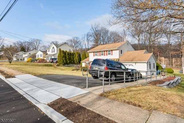 view of road featuring sidewalks and a residential view