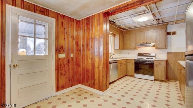 kitchen with a healthy amount of sunlight, stainless steel dishwasher, white gas stove, and wooden walls