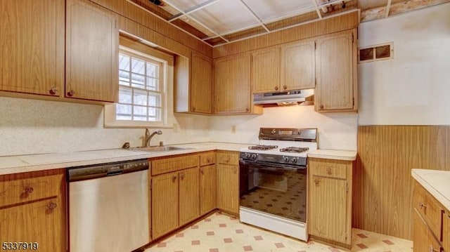 kitchen with dishwasher, sink, and white gas range oven