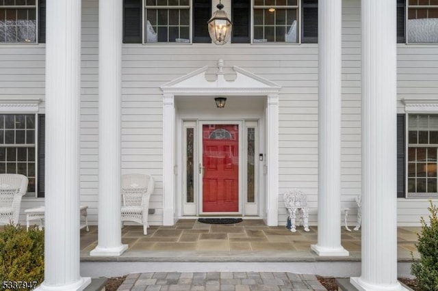 doorway to property featuring a porch