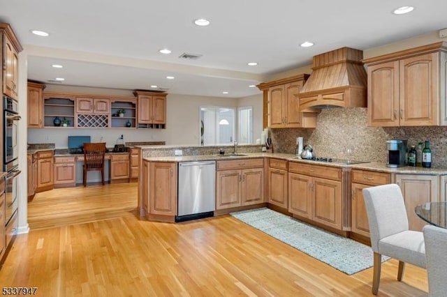 kitchen featuring light wood-style flooring, stainless steel appliances, premium range hood, visible vents, and open shelves