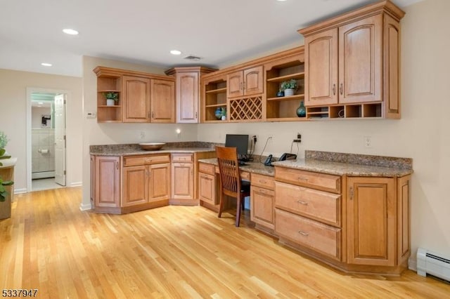 office featuring a baseboard radiator, recessed lighting, a baseboard heating unit, light wood-type flooring, and built in desk