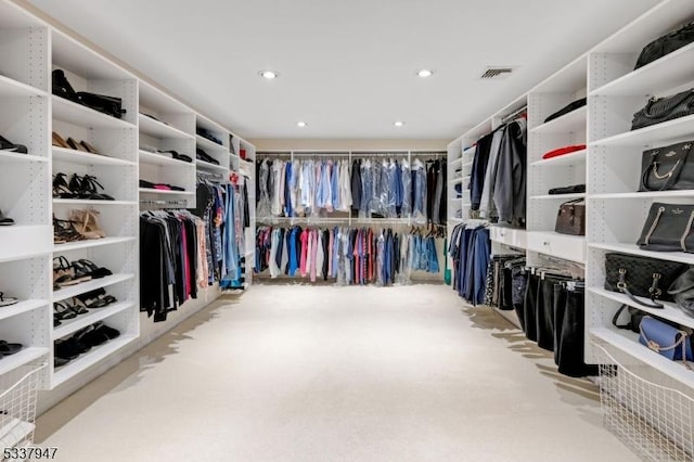 spacious closet featuring carpet floors and visible vents